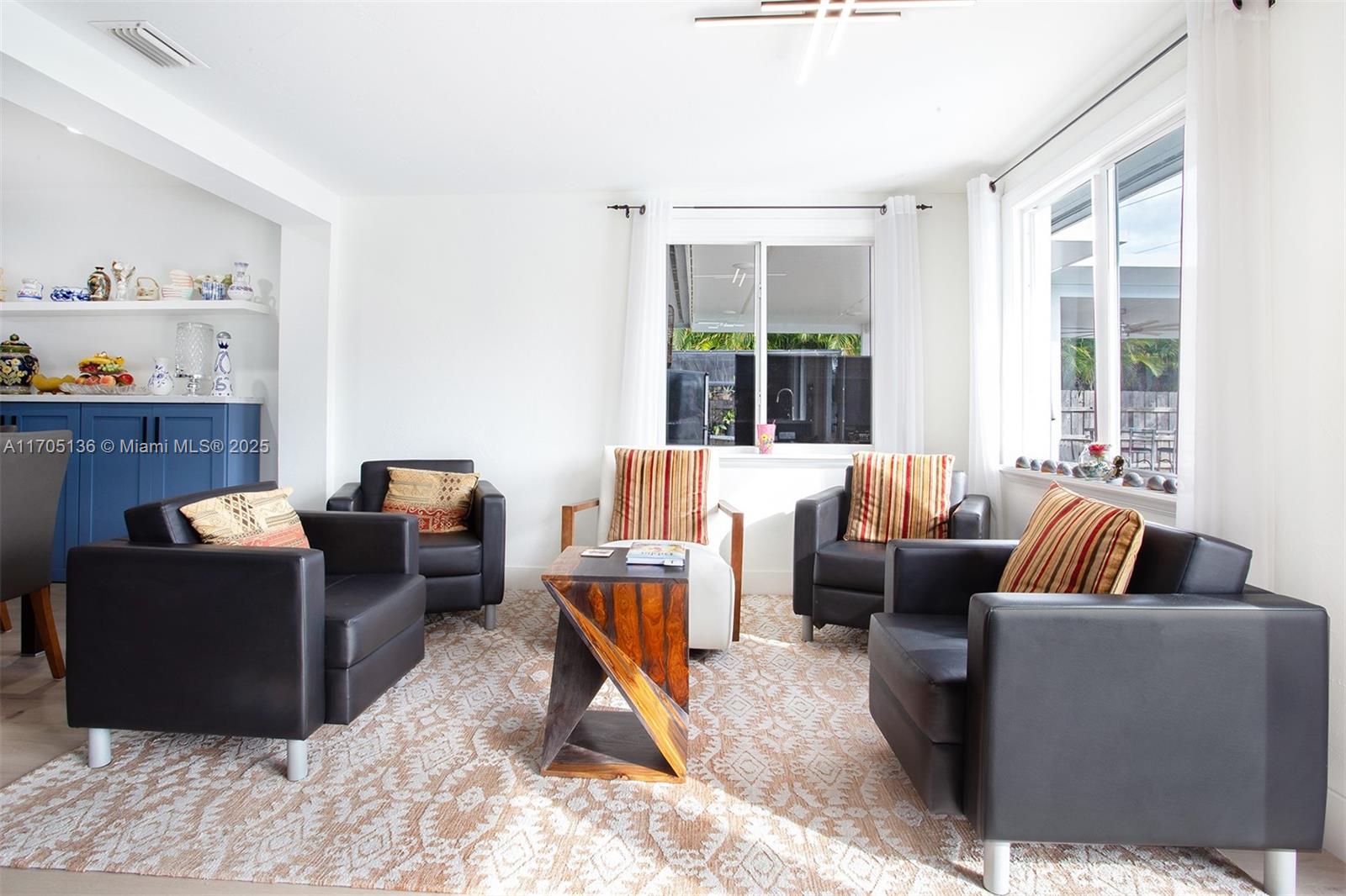 808 Mission Hill Road Boynton Beach, FL 33435 - Photo 25 of 68 a living room with furniture and a window