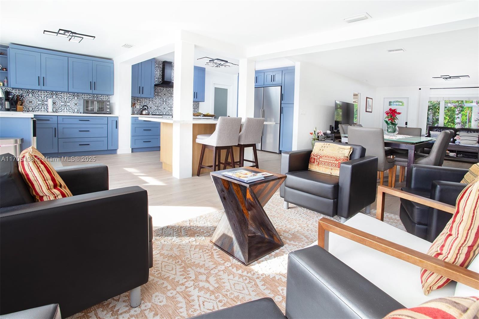 808 Mission Hill Road Boynton Beach, FL 33435 - Photo 26 of 68 a living room with furniture and a kitchen view