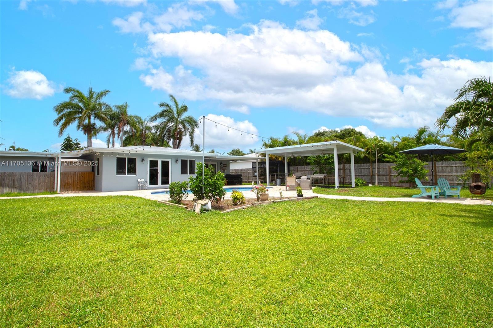 808 Mission Hill Road Boynton Beach, FL 33435 - Photo 38 of 68 a front view of house with yard and seating area