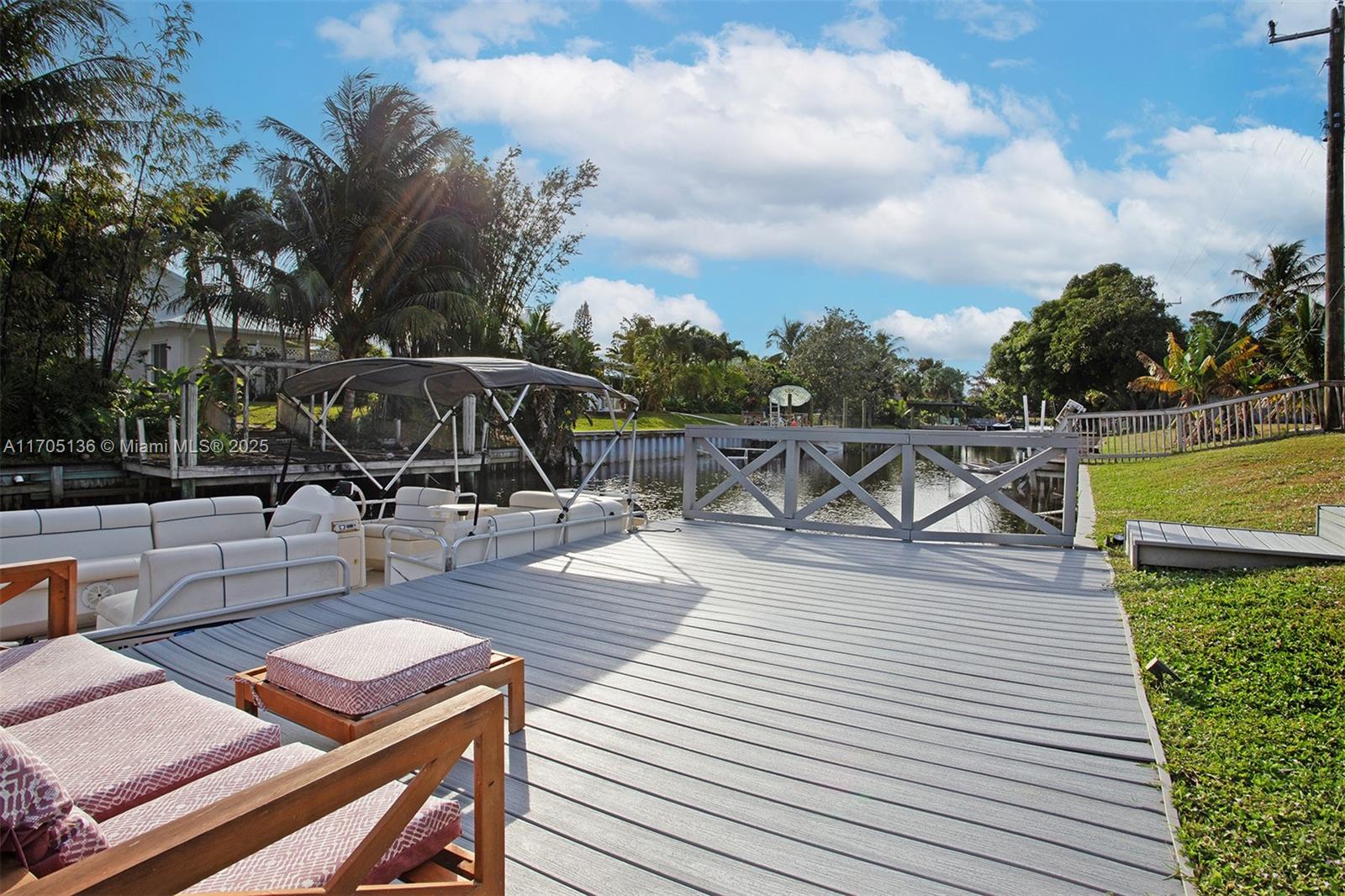 808 Mission Hill Road Boynton Beach, FL 33435 - Photo 42 of 68 a view of a roof deck with dining table and chair