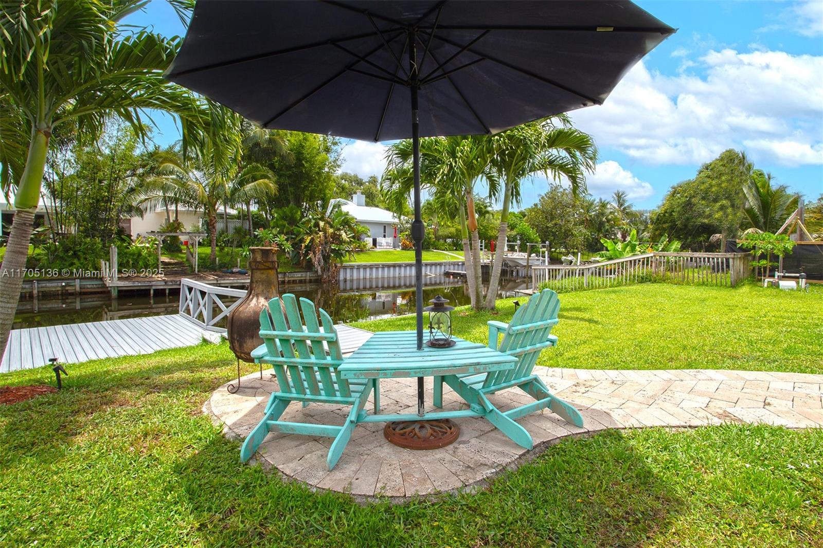 808 Mission Hill Road Boynton Beach, FL 33435 - Photo 6 of 68 a view of a chairs and table in the yard