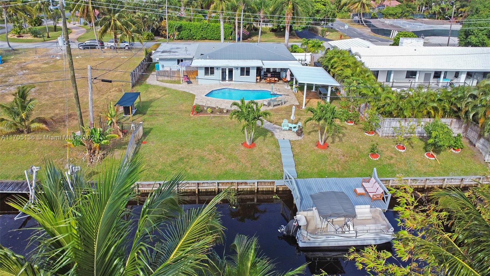 808 Mission Hill Road Boynton Beach, FL 33435 - Photo 10 of 68 an aerial view of a house with swimming pool garden and patio