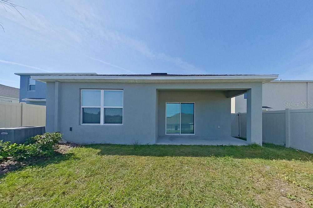 32044 Katelin Circle Leesburg, FL 34748 - Photo 19 of 20 a front view of a house with garden