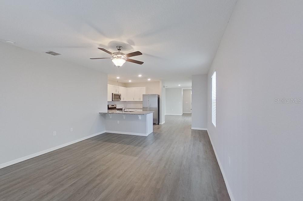 32044 Katelin Circle Leesburg, FL 34748 - Photo 8 of 20 a view of kitchen with wooden floor and a kitchen
