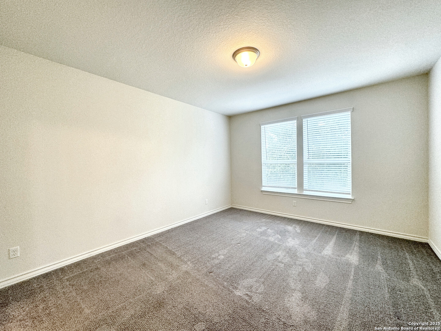 2858 Ridge Berry Road New Braunfels, TX 78130 - Photo 13 of 19 an empty room with a window
