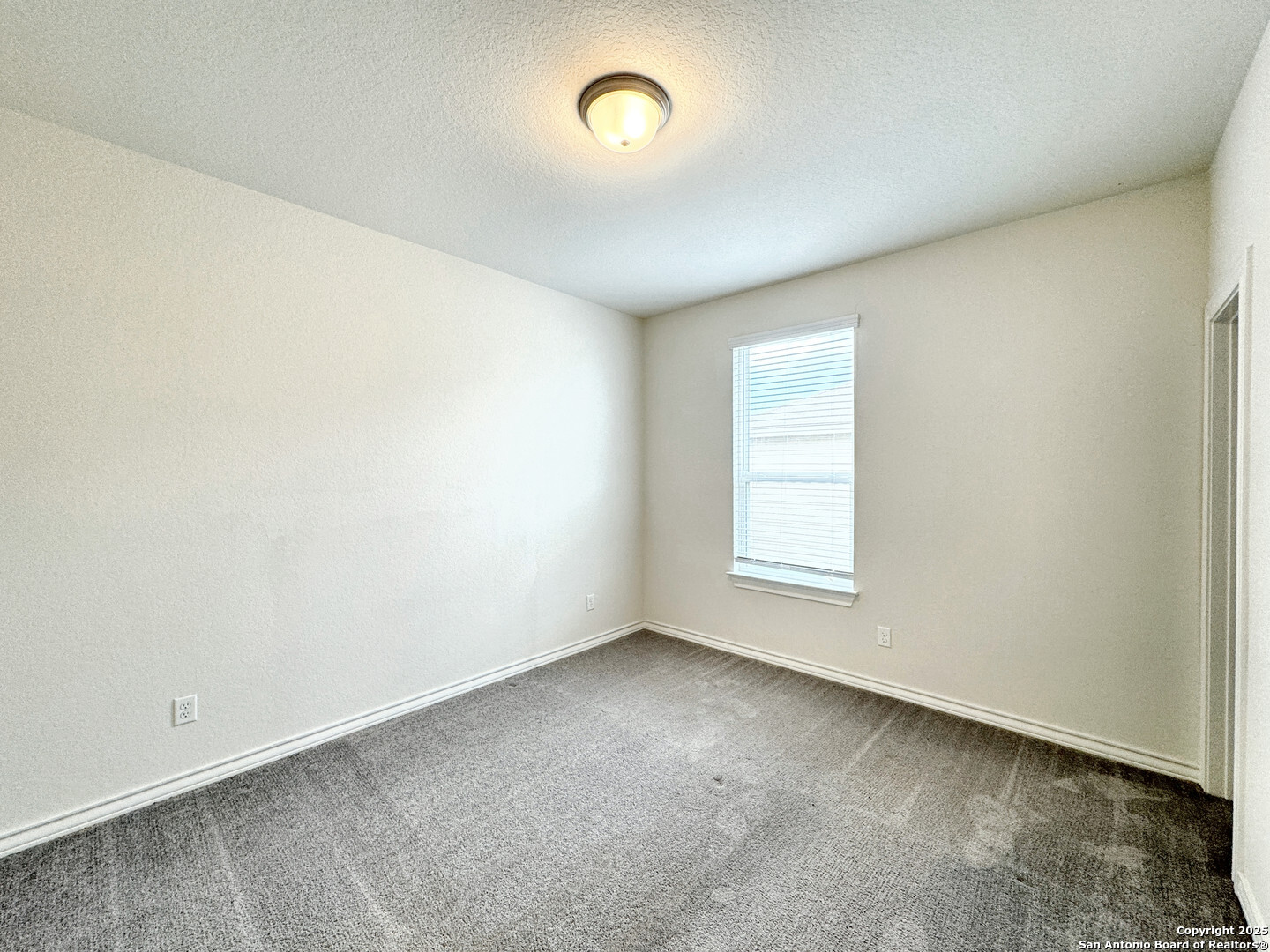 2858 Ridge Berry Road New Braunfels, TX 78130 - Photo 2 of 19 an empty room with a window