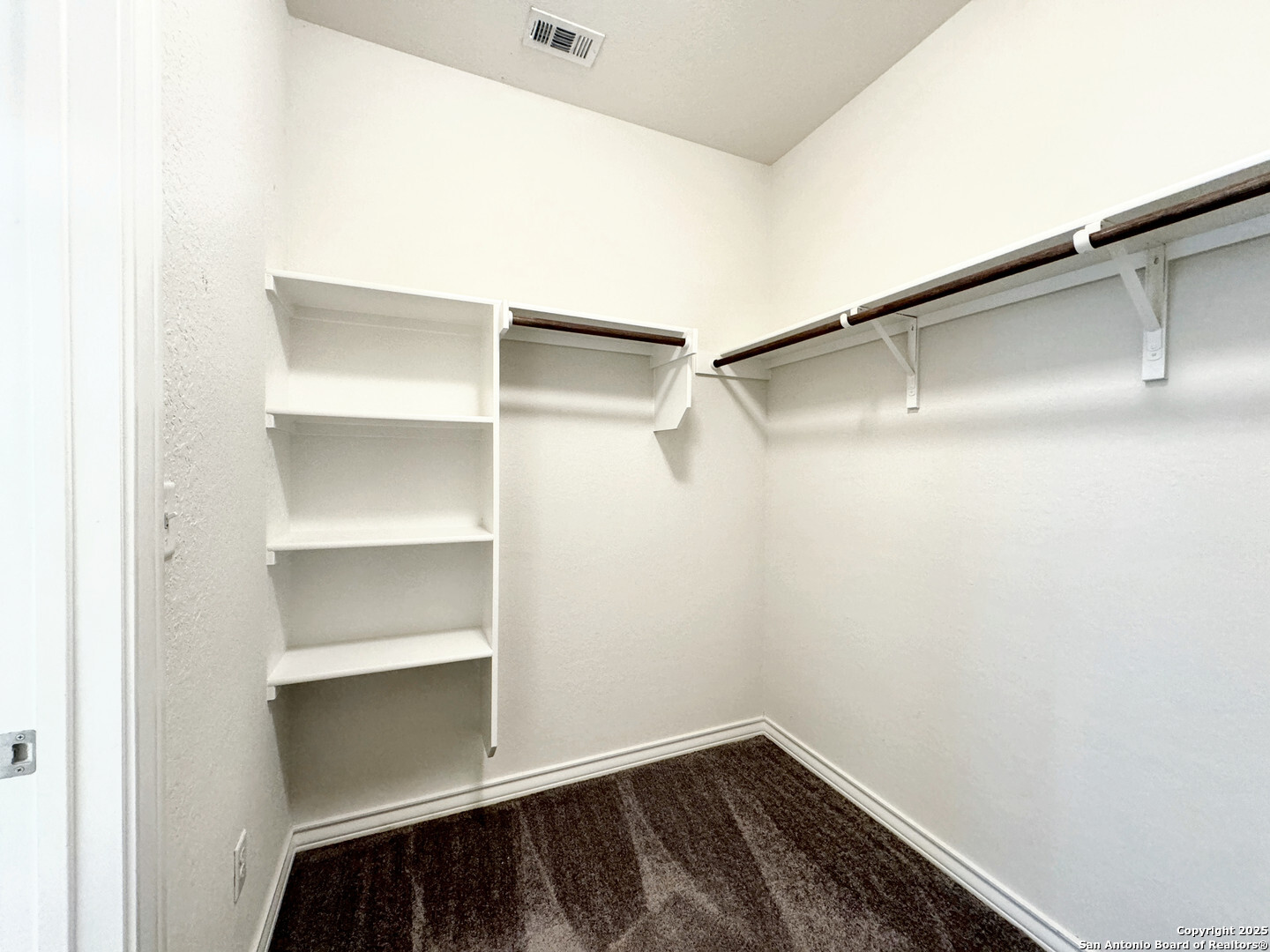 2858 Ridge Berry Road New Braunfels, TX 78130 - Photo 10 of 19 a view of walk in closet with empty racks