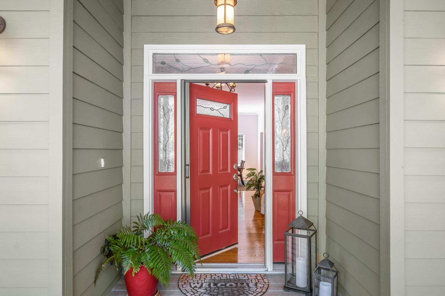 943 Eden Valley Road Colfax, CA 95713 - Photo 11 of 82 a front view of a house with a red door and door