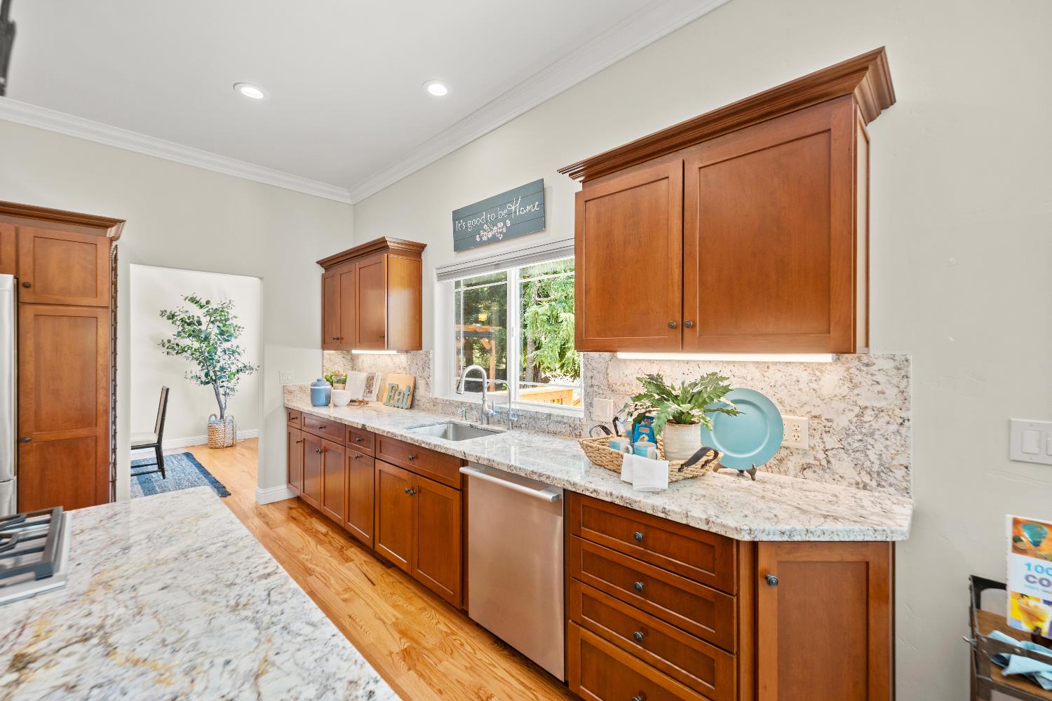943 Eden Valley Road Colfax, CA 95713 - Photo 29 of 82 a kitchen with granite countertop stainless steel appliances sink stove microwave and cabinets