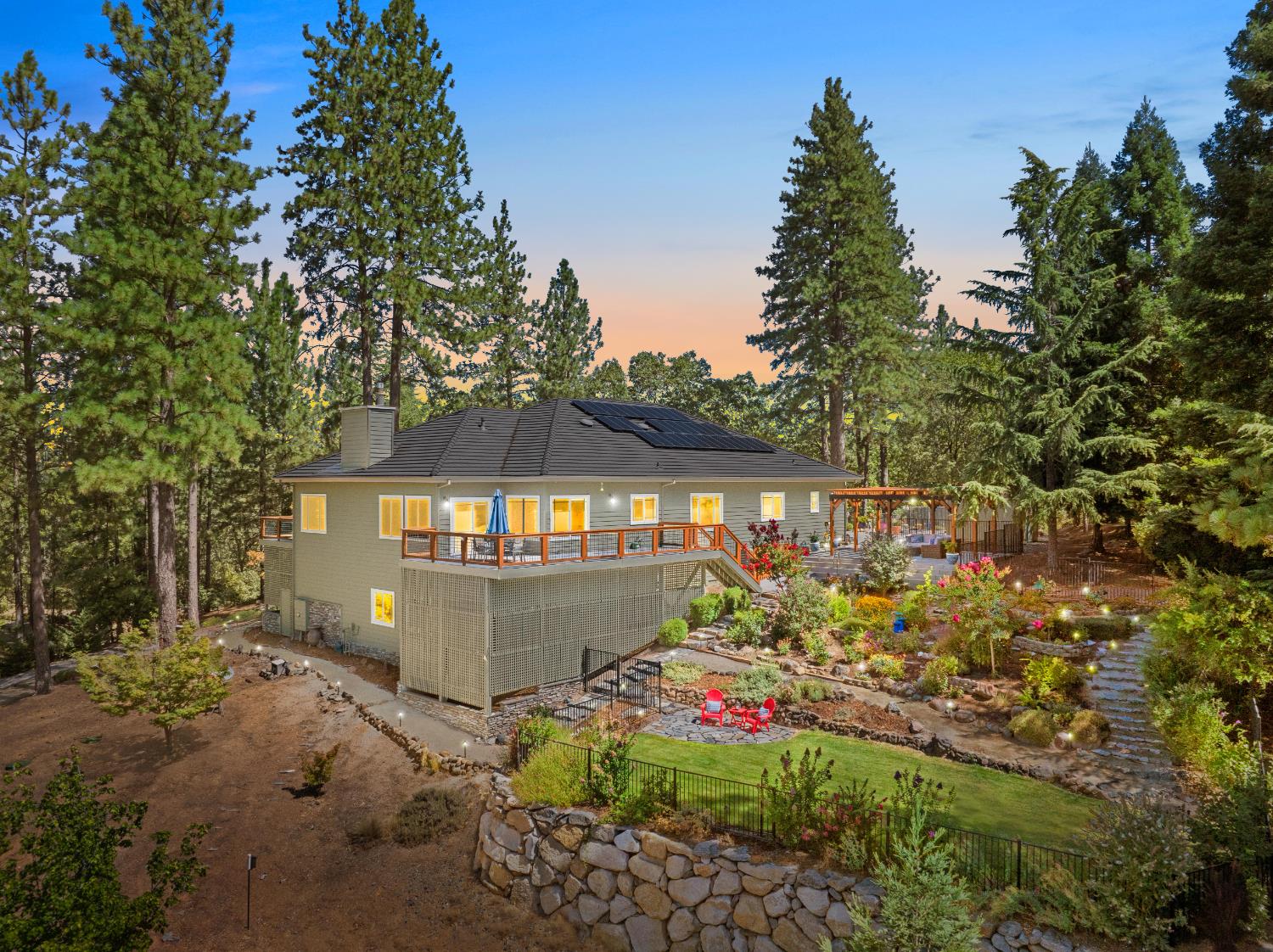 943 Eden Valley Road Colfax, CA 95713 - Photo 3 of 82 a view of a backyard with plants and a lake view