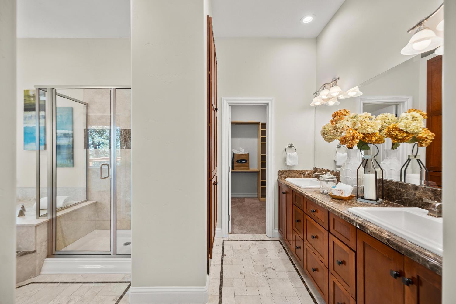 943 Eden Valley Road Colfax, CA 95713 - Photo 36 of 82 a spacious bathroom with a granite countertop sink a mirror and a shower