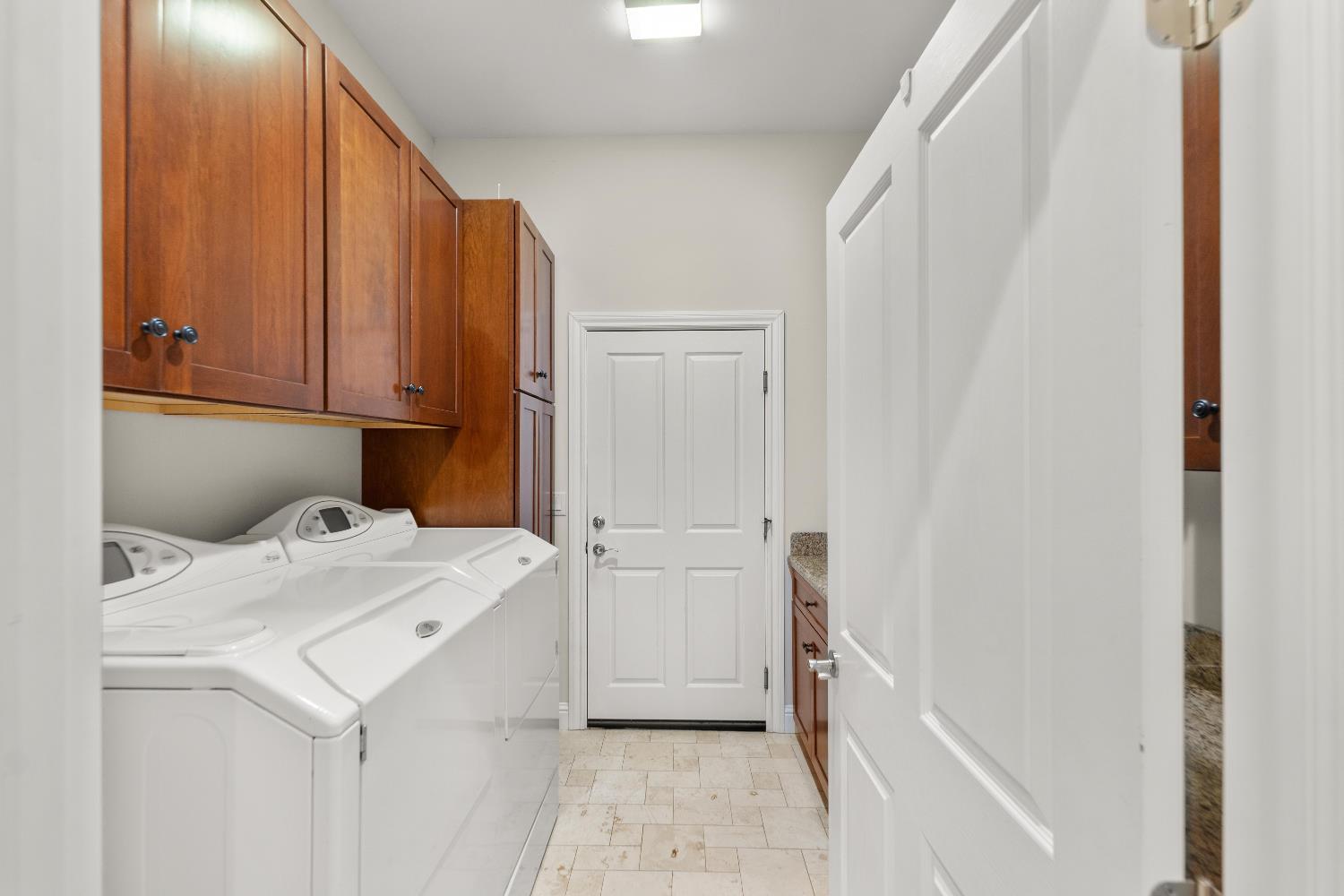 943 Eden Valley Road Colfax, CA 95713 - Photo 56 of 82 Laundry room with storage and sink. Washer and Dryer come with the home