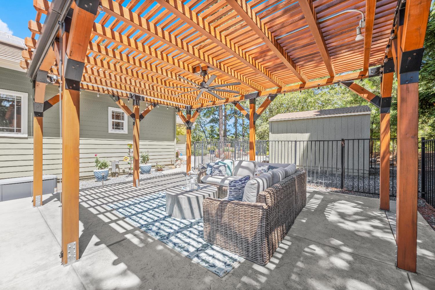 943 Eden Valley Road Colfax, CA 95713 - Photo 62 of 82 a view of a patio with a table and chairs and wooden fence