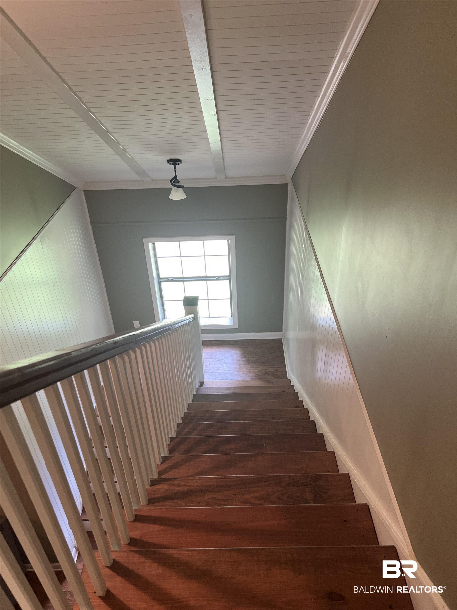 102 Brown Road Evergreen, AL 36401 - Photo 16 of 26 Stairway with crown molding, wood finished floors, and beamed ceiling