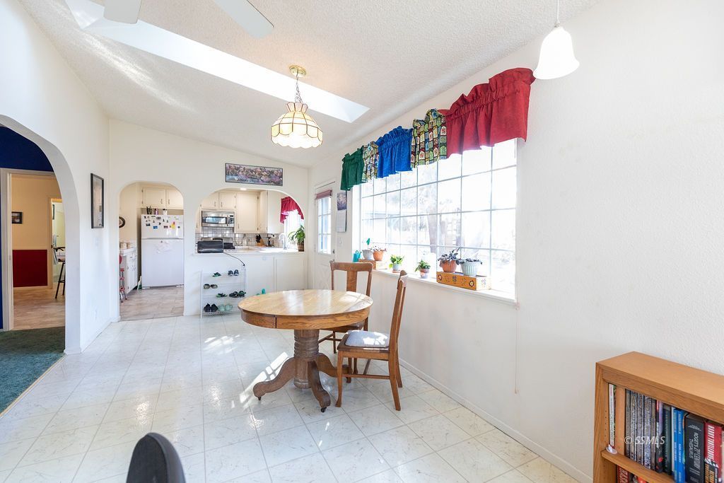 737 Scott Circle Ridgecrest, CA 93555 - Photo 11 of 49 a dining room with furniture and a table