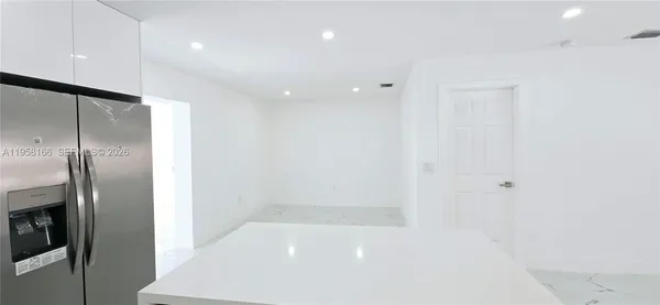 an empty room with wooden floor