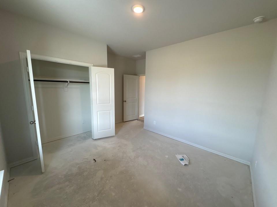 267 Mdw Vista Drive Rhome, TX 76078 - Photo 7 of 13 an empty room with closet and a window