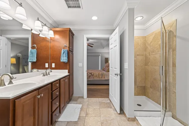 a bathroom with a shower sink and mirror