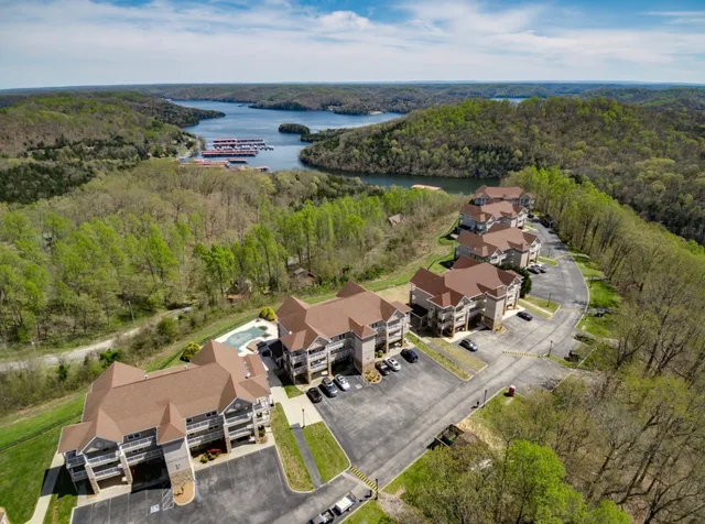 an aerial view of a house with garden space and outdoor seating