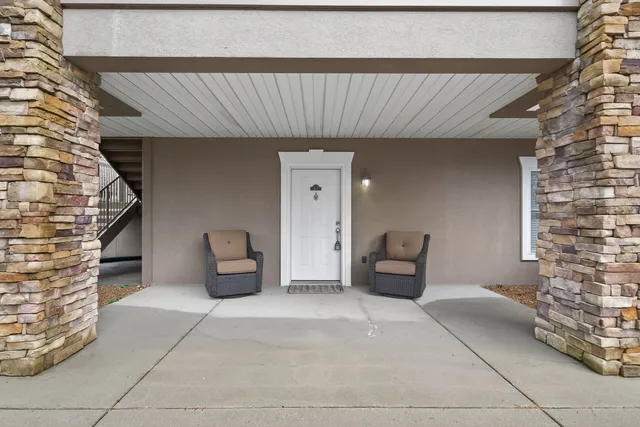 a front view of a house with couches