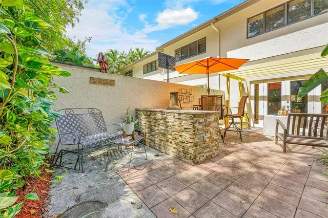 a patio with table and chairs