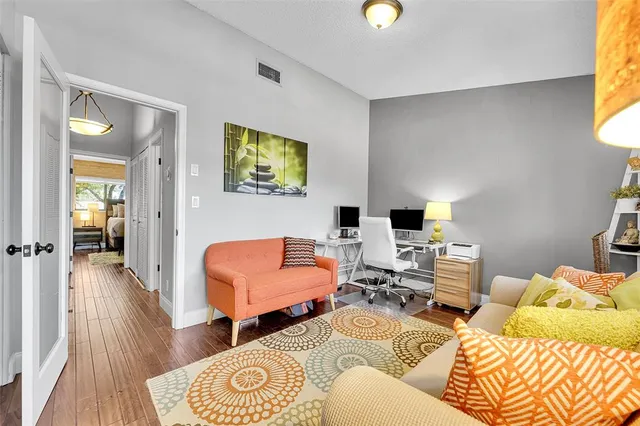 a living room with furniture and a rug