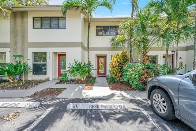 a front view of a building with garden