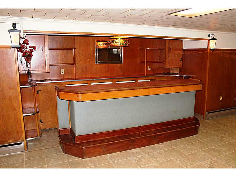 435 Budlong Road Cranston, RI 02920 - Photo 17 of 21 Cellar or Basement. This handmade wood bar is original to the house and has a sink built in. New ceramic tile floor throughout.