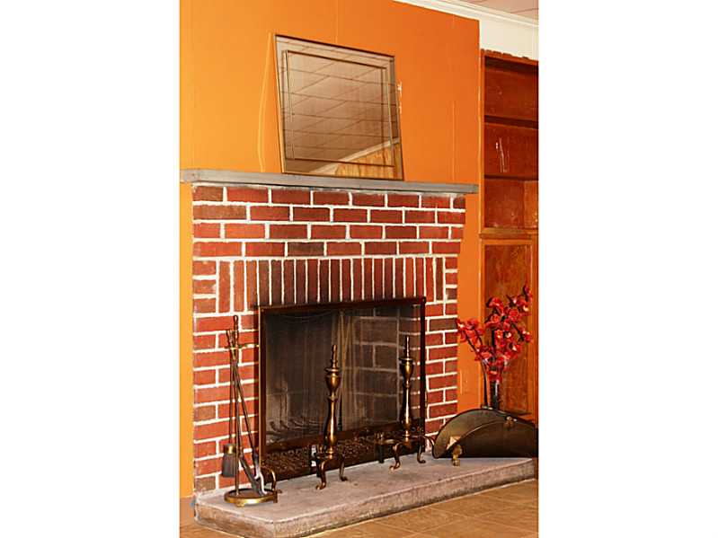 435 Budlong Road Cranston, RI 02920 - Photo 19 of 21 Cellar or Basement. Wood burning brick fireplace creates an unexpected warm and cozy atmosphere.