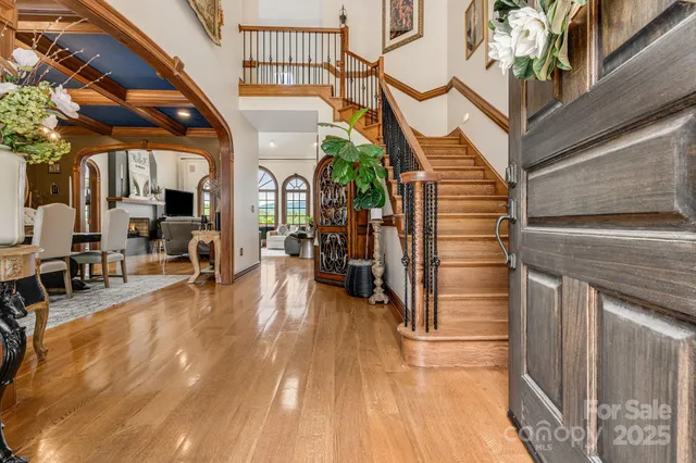 a view of living room with furniture and wooden floor