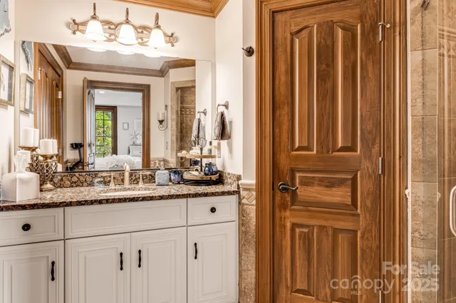 a bathroom with a double vanity sink and a mirror