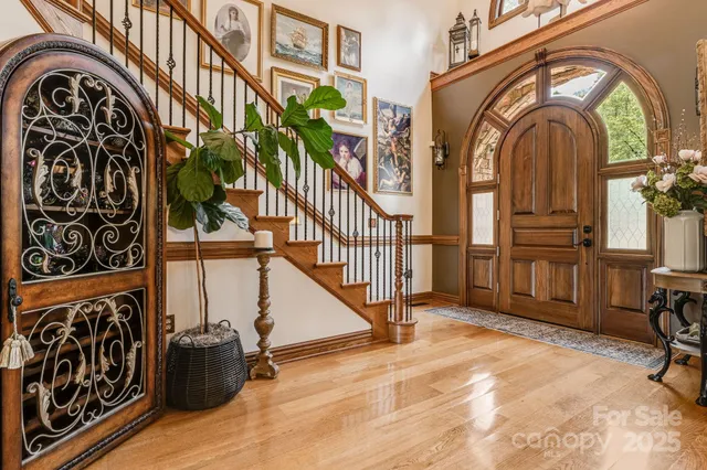 a view of an entryway with wooden floor