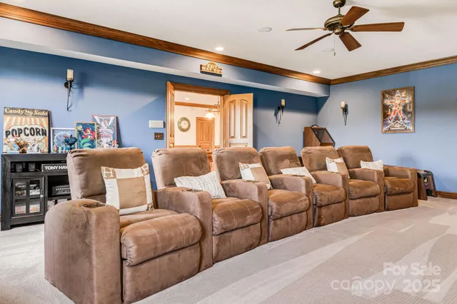 a bedroom with furniture and a flat screen tv