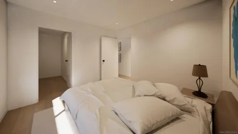 a bedroom with a bed and a lamp