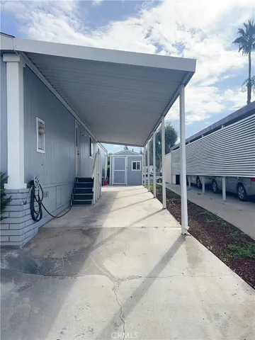 a kitchen with a stove a refrigerator and a sink
