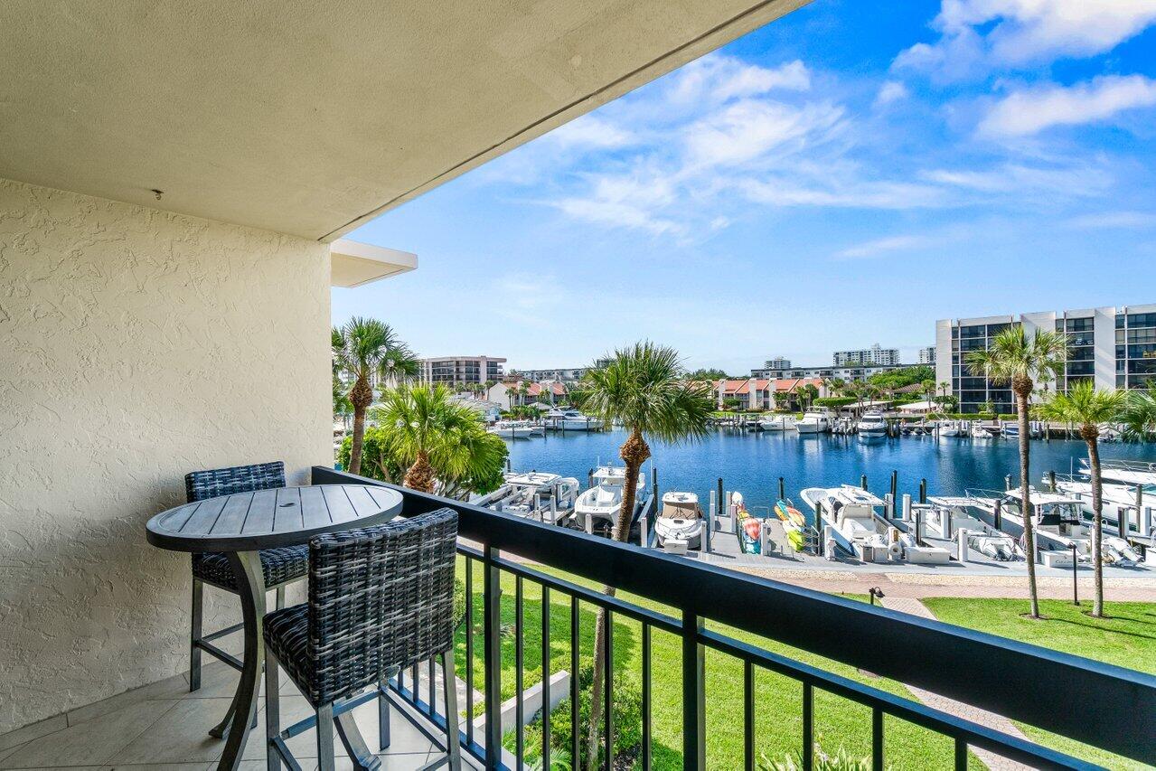 2707 North Ocean Boulevard, Unit 301D Boca Raton, FL 33431 - Photo 24 of 43 a view of a chairs and table in patio