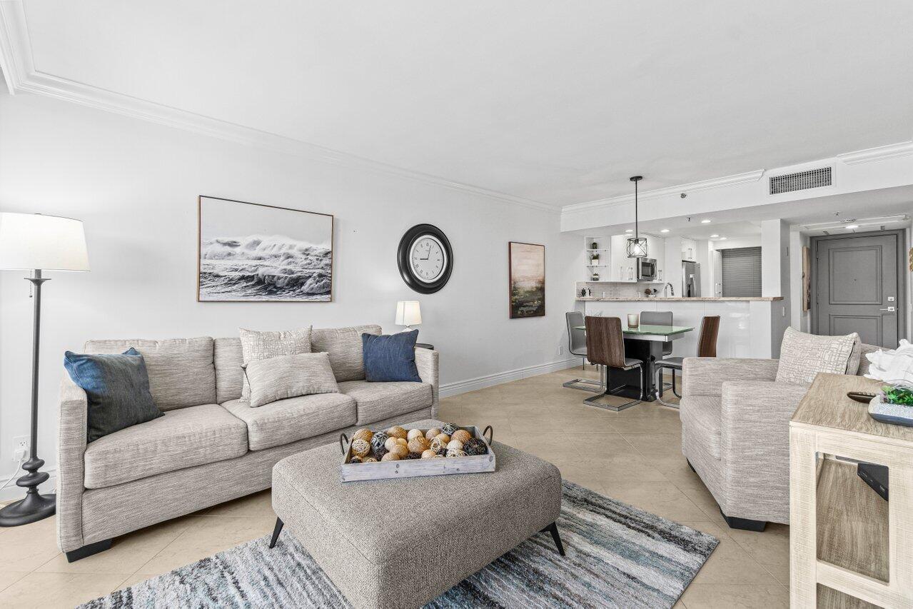 2707 North Ocean Boulevard, Unit 301D Boca Raton, FL 33431 - Photo 10 of 43 a living room with furniture kitchen view and a table