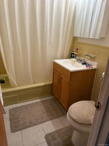 a view of a balcony with a large tree