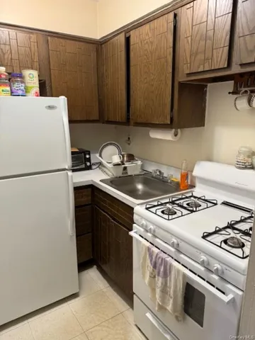 a kitchen with a stove and a refrigerator