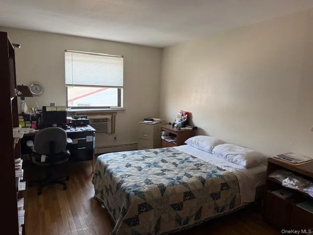 a bedroom with bed and window