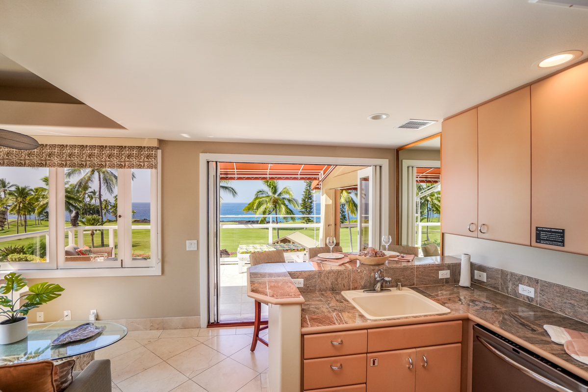 78-6834 Ali‘i Drive, Unit 22B 201 & 202 Kailua-Kona, HI 96740 - Photo 14 of 24 a kitchen that has a sink and a stove