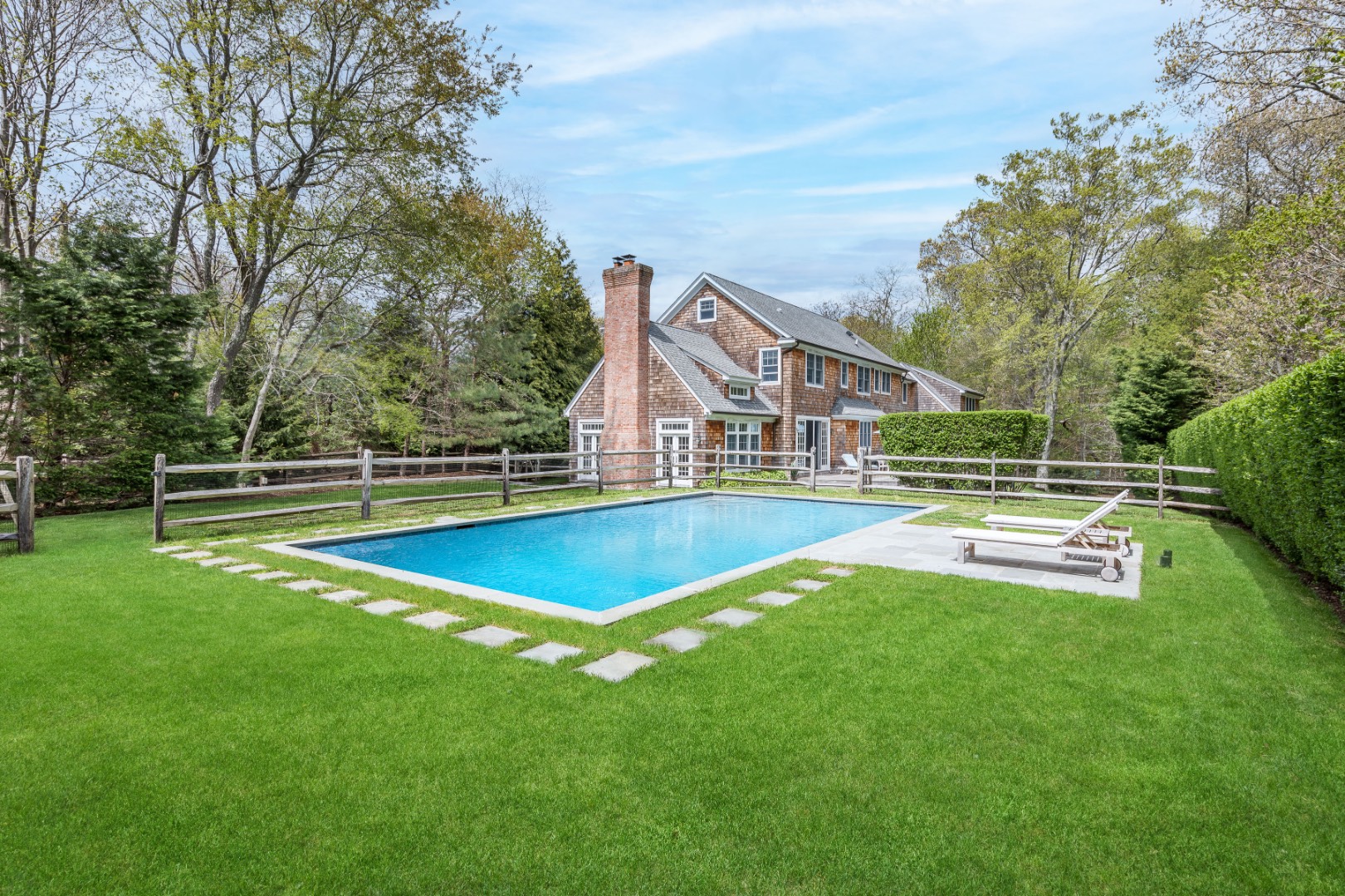 160 Ferry Road Sag Harbor, NY 11963 - Photo 1 of 25 a view of a house with swimming pool and a yard