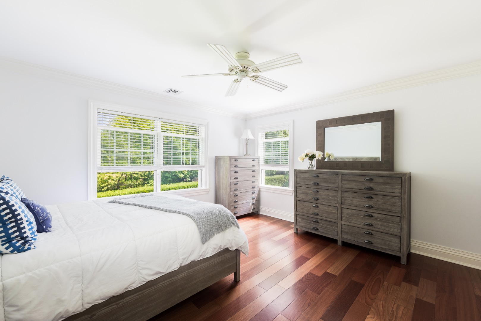 160 Ferry Road Sag Harbor, NY 11963 - Photo 18 of 25 a bedroom with a bed and wooden floor