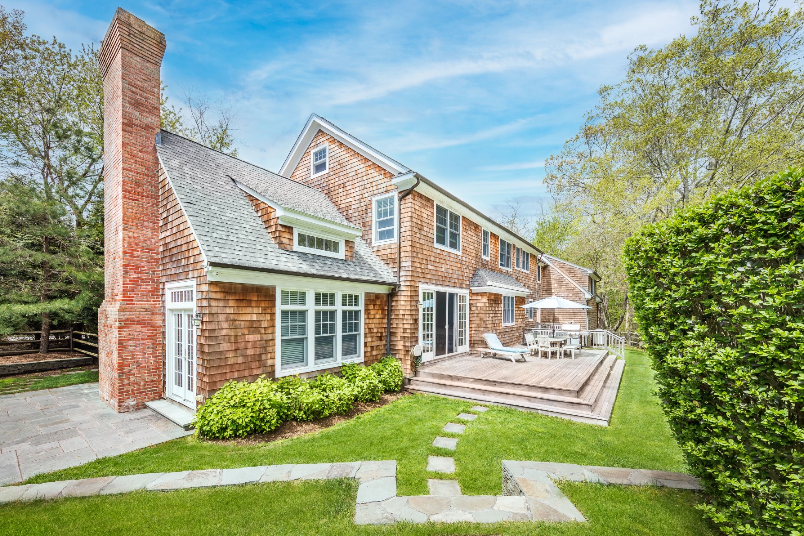 160 Ferry Road Sag Harbor, NY 11963 - Photo 3 of 25 a front view of a house with a yard
