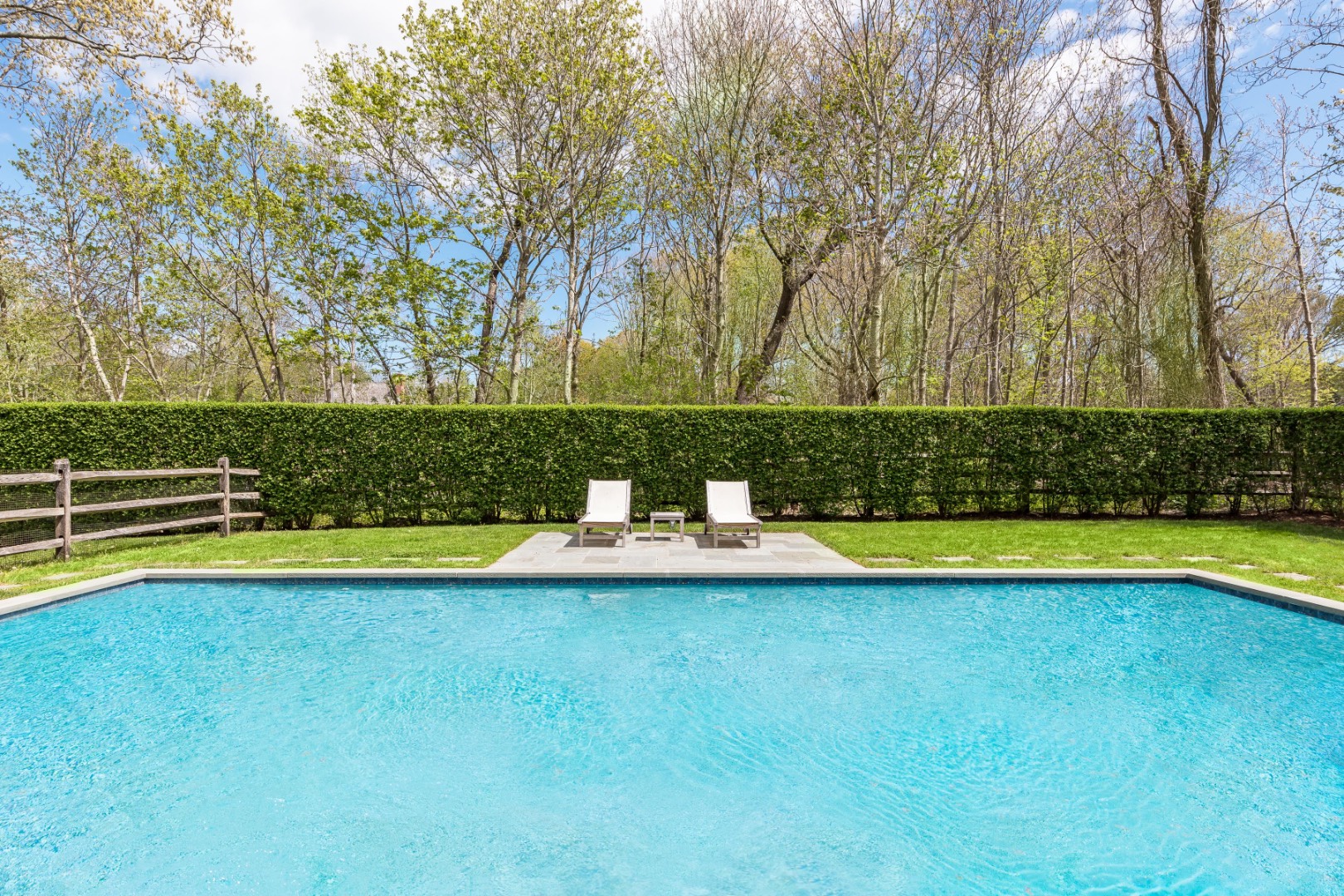 160 Ferry Road Sag Harbor, NY 11963 - Photo 23 of 25 a view of a swimming pool with an outdoor space and seating area