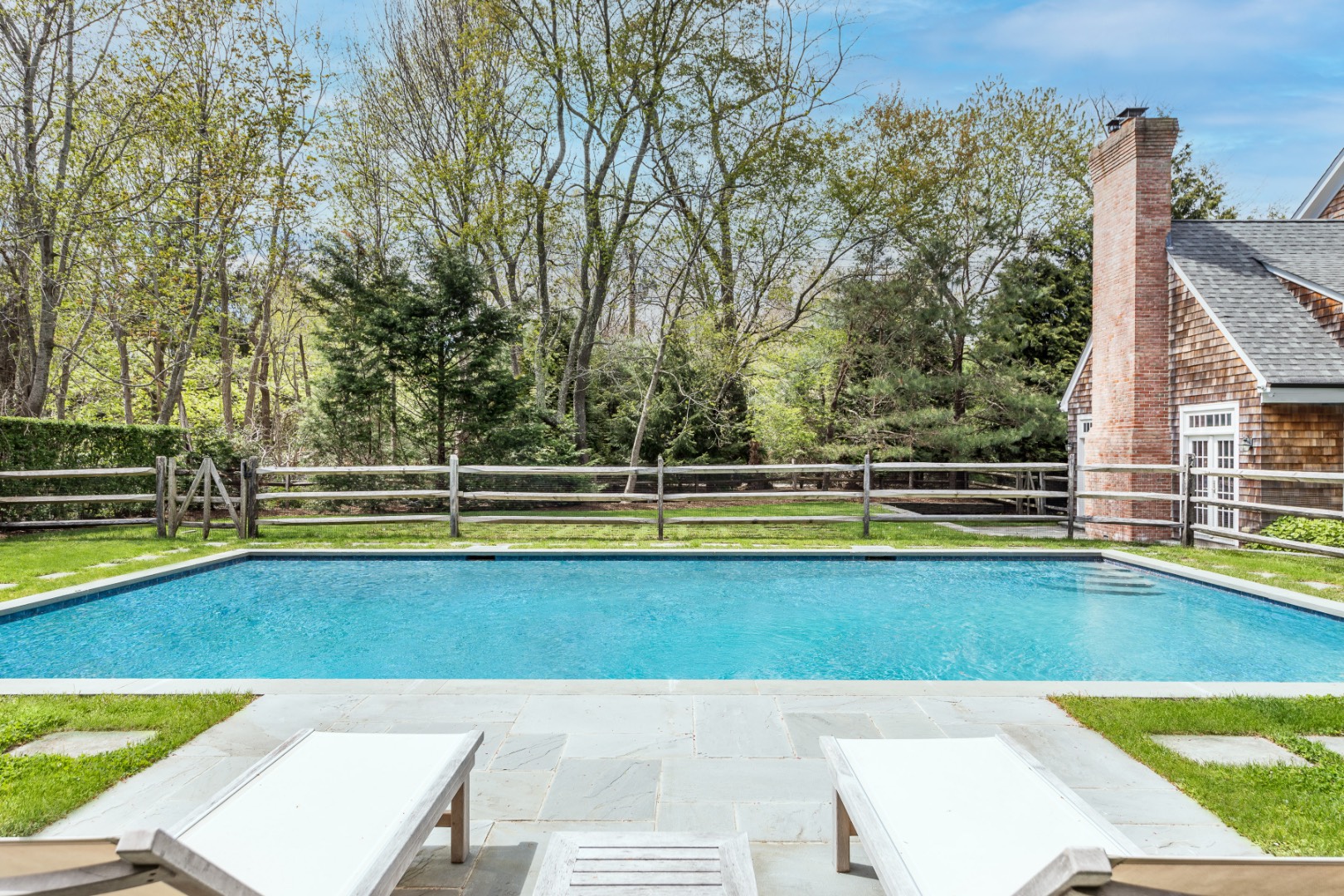 160 Ferry Road Sag Harbor, NY 11963 - Photo 24 of 25 a view of a swimming pool with an outdoor space and seating area