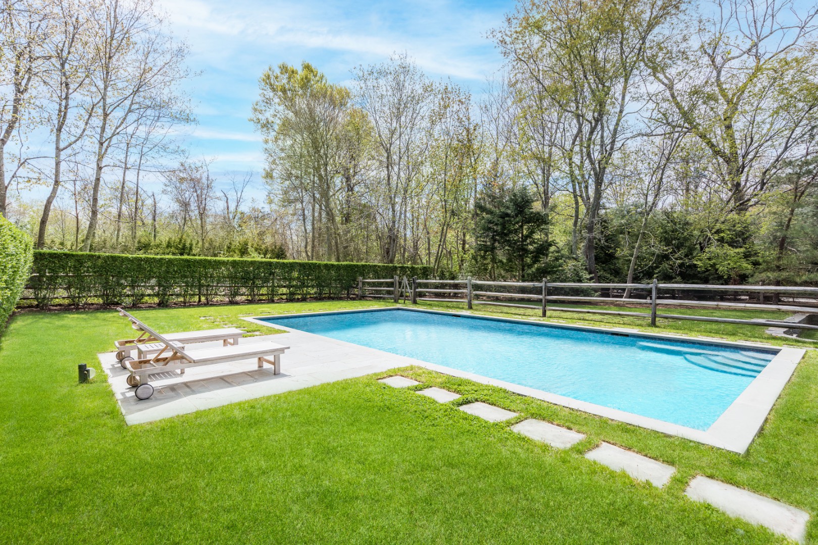 160 Ferry Road Sag Harbor, NY 11963 - Photo 4 of 25 a view of a swimming pool with a yard