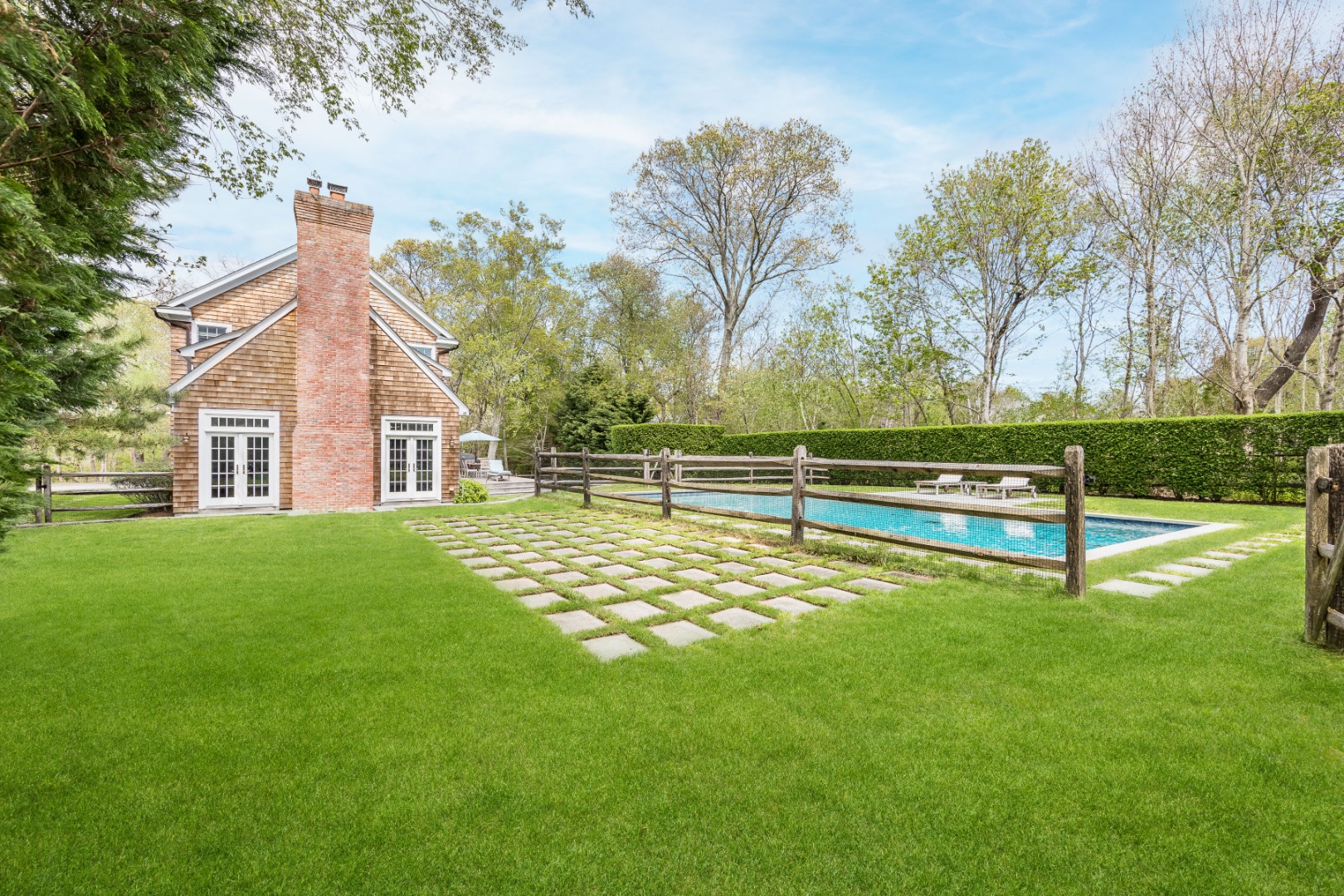 160 Ferry Road Sag Harbor, NY 11963 - Photo 6 of 25 a house view with a garden space