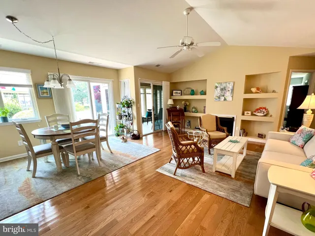 a living room with furniture dining table and a fireplace