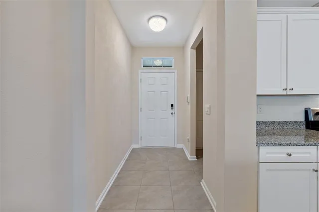 a view of hallway with cabinets
